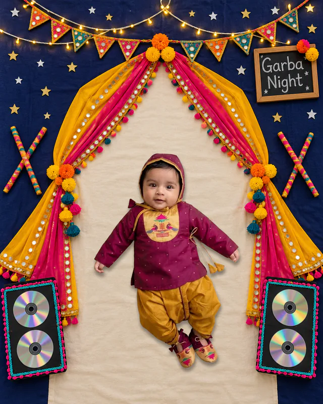 Baby beneath a starry Garba Night canopy with yellow and pink drapes, marigolds, bunting and speakers